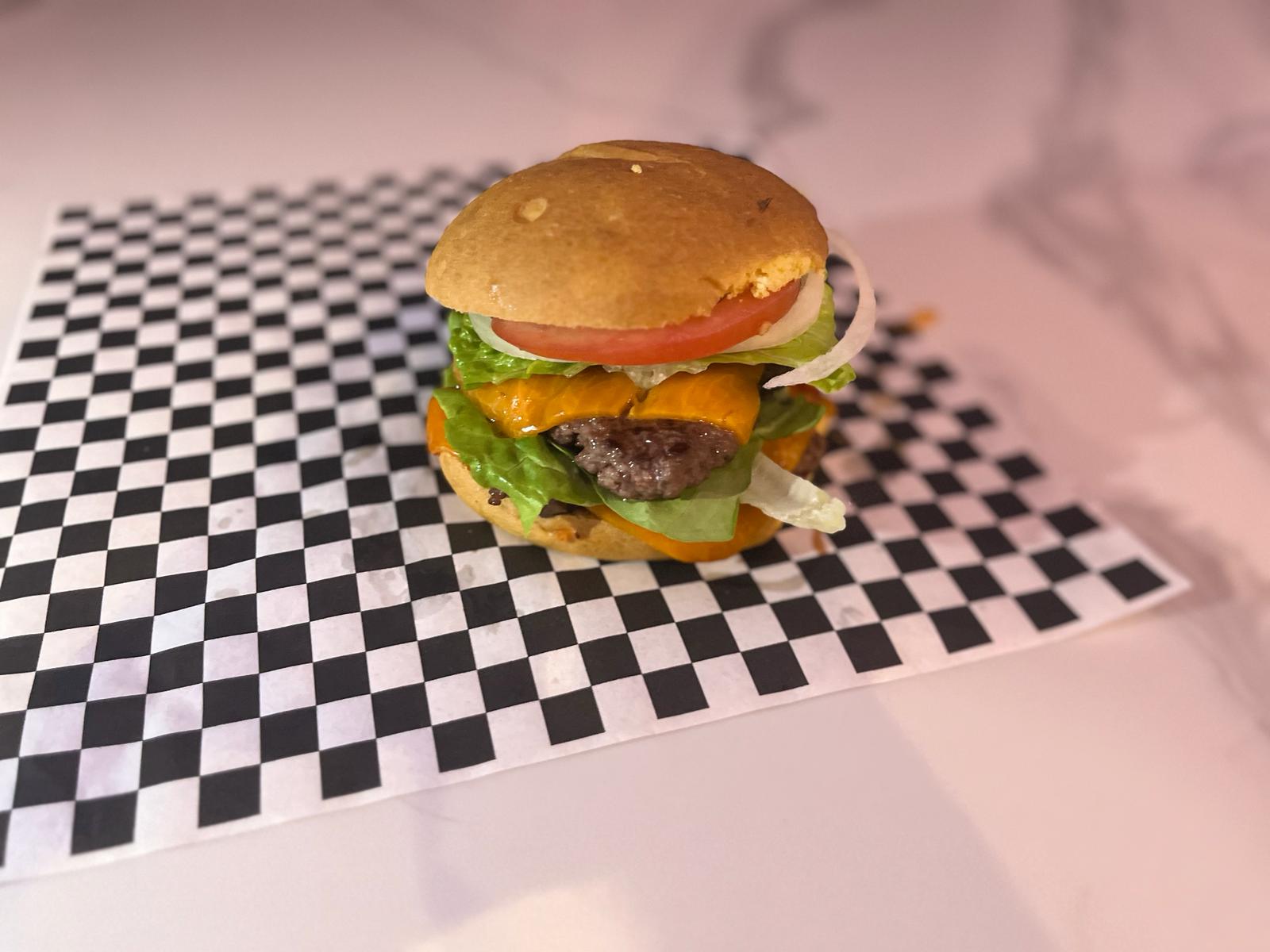 Our beef burger with melted cheese, lettuce, tomato and onion
