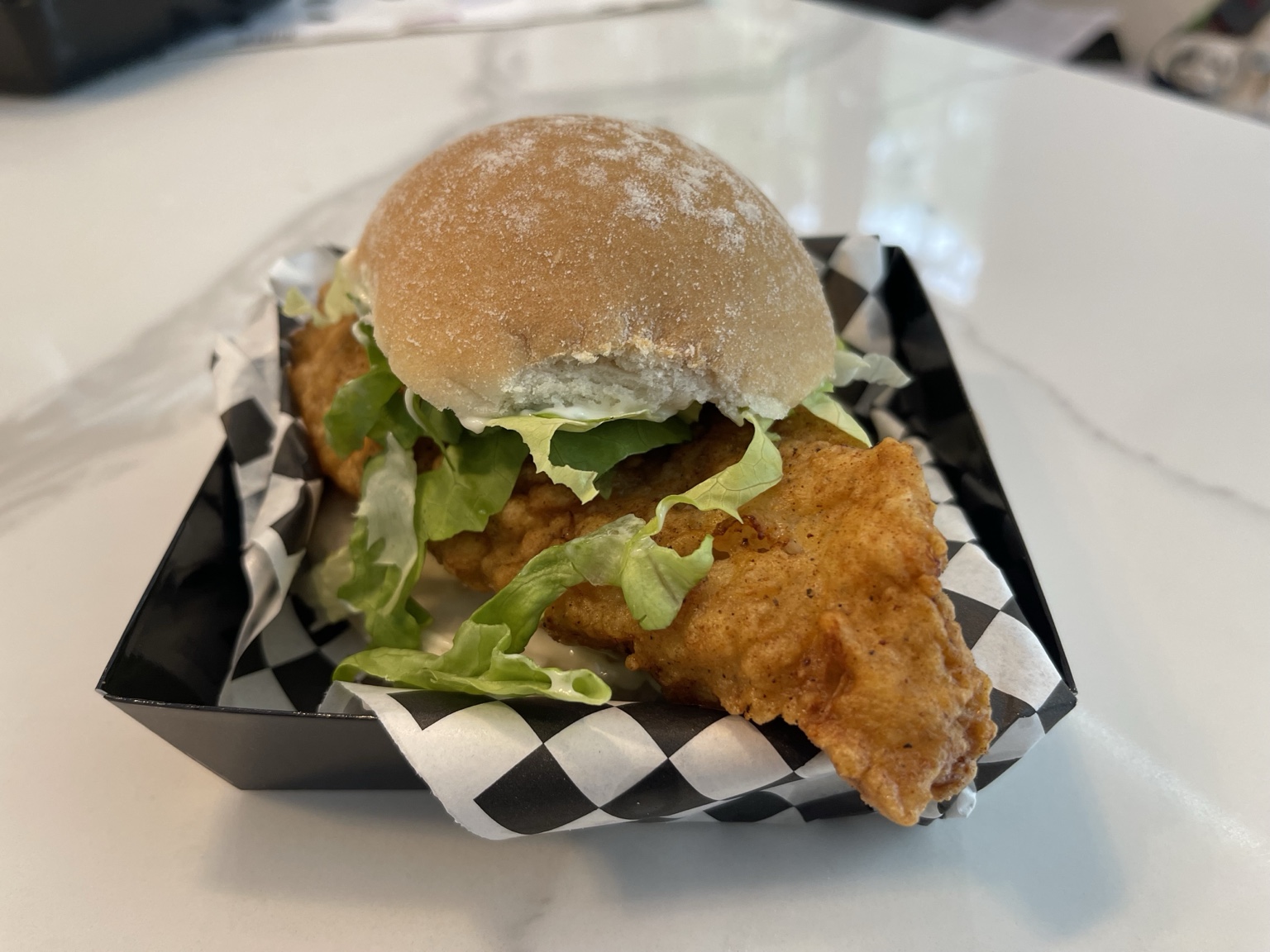 Crispy chicken burger with lettuce and mayonnaise